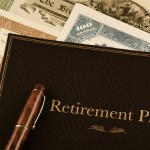 retirement plan portfolio on top of vintage stock certificates